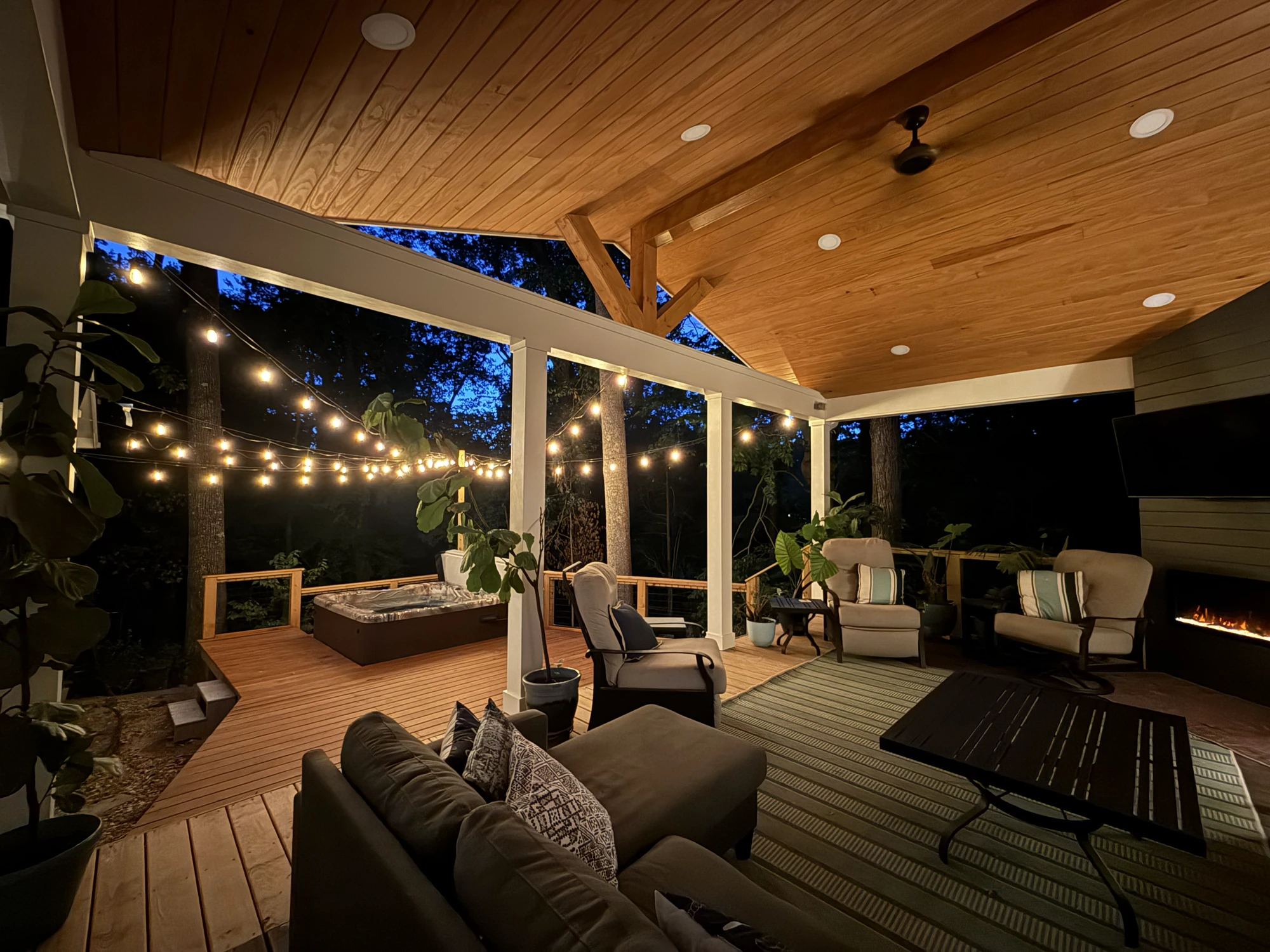 M22 Construction addition — covered outdoor living room with fireplace