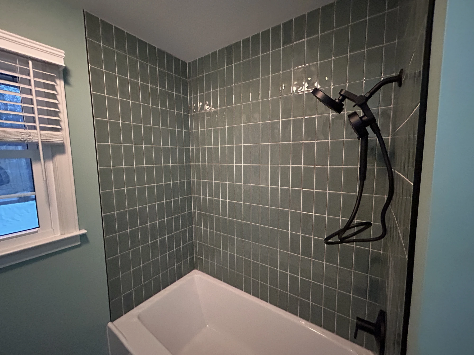 M22 Construction bathroom remodel — tiled shower and soaking tub
